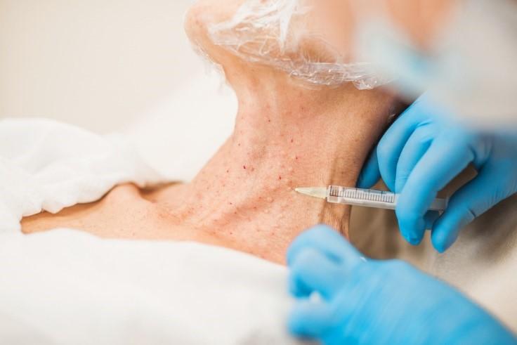 picture of a womans neck getting mesotherapy skin boosters treatment