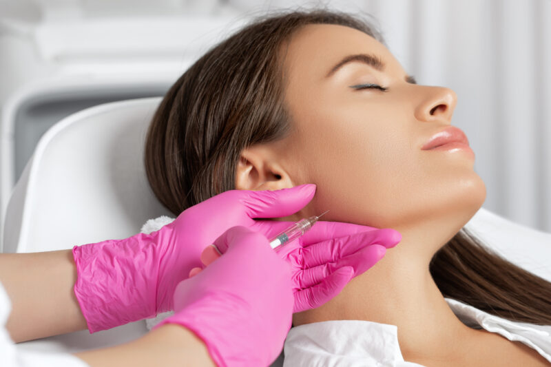 picture of woman receiving jaw filler treatment