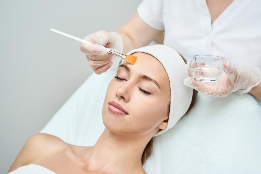 picture of woman receiving chemical peel treatment