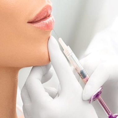 picture of a young woman receiving lip filler
